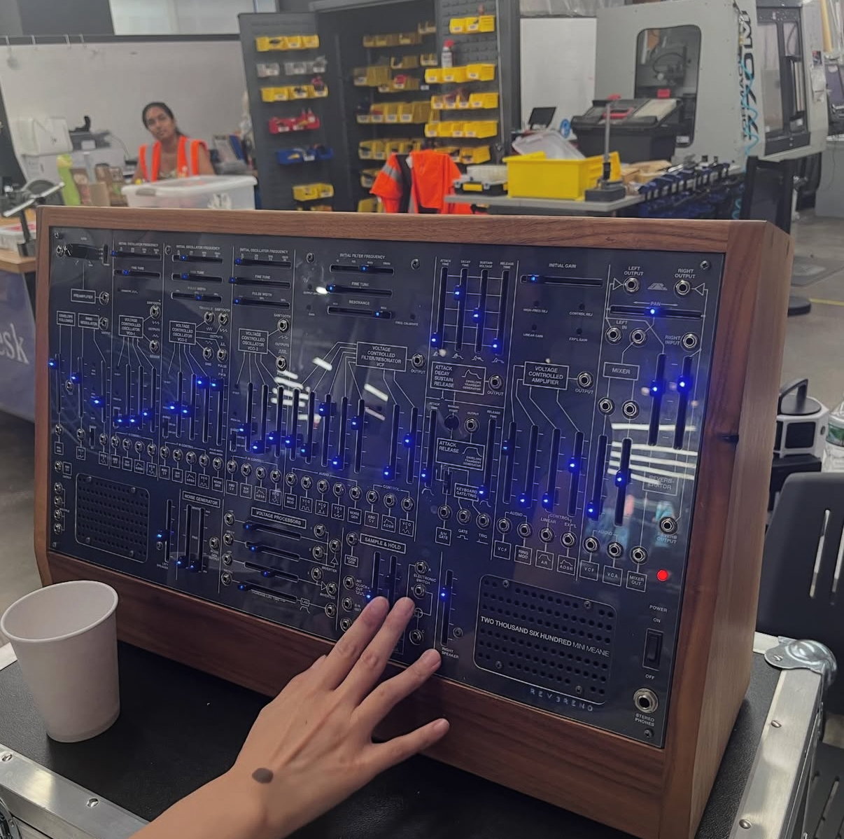 Hand reading a tactile synthesizer control panel
